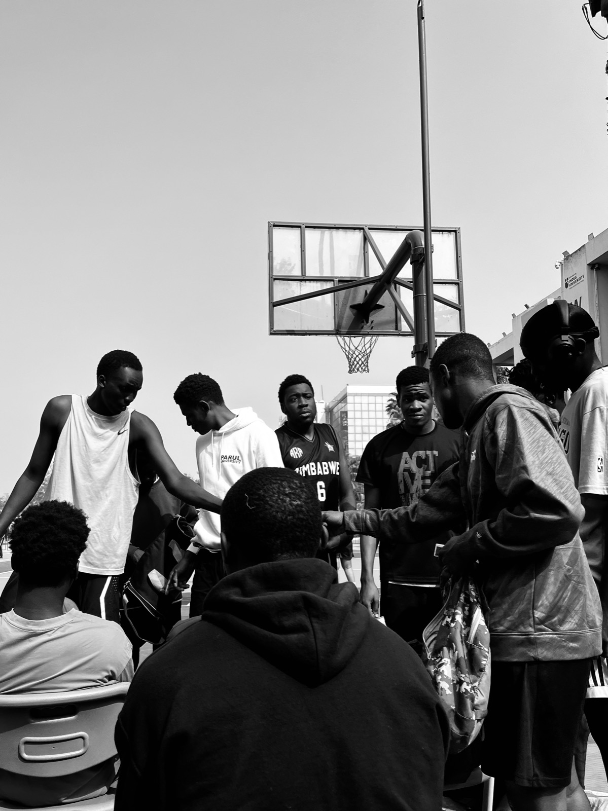 Monochrome album cover — street basketball in black and white